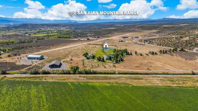 a view of a field with an ocean view