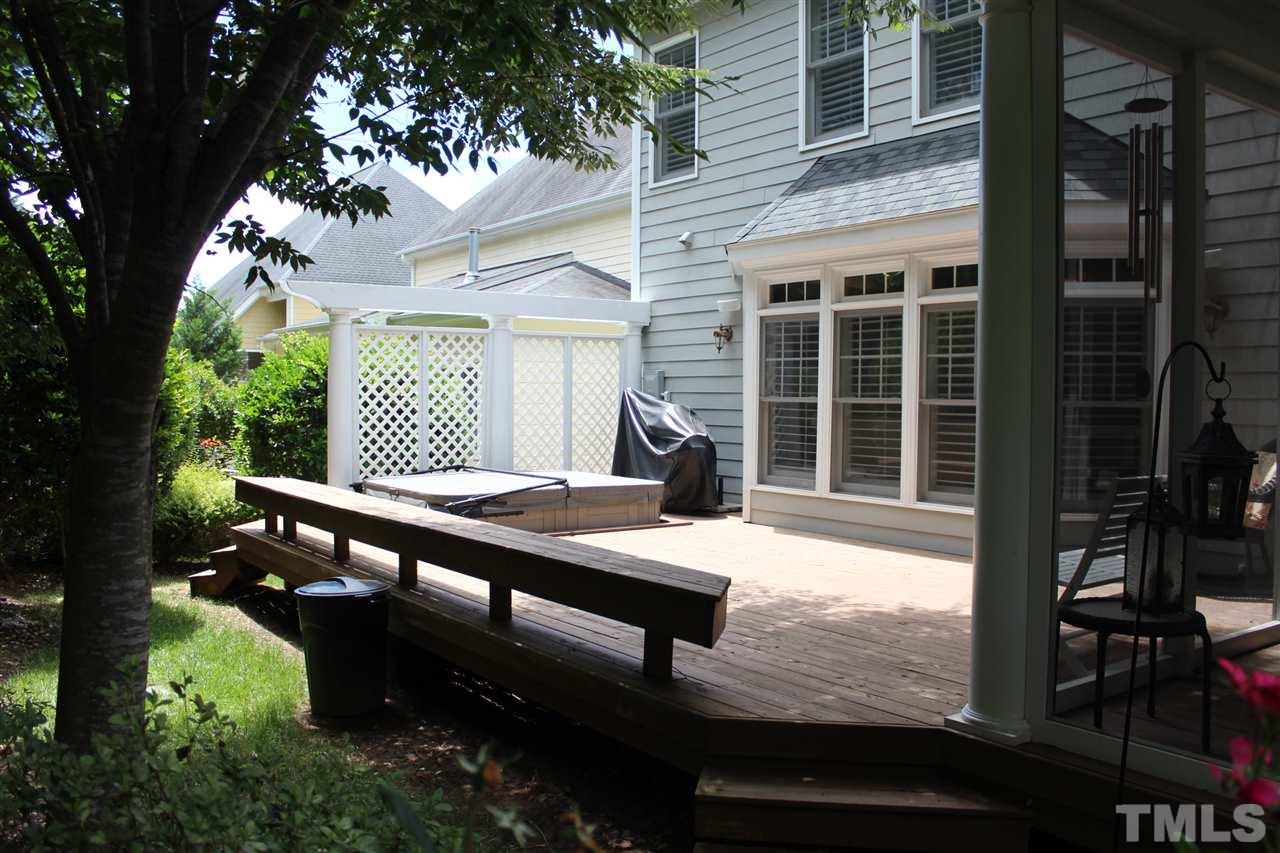 12336 Beestone Lane Raleigh, NC 27614 - Photo 15 of 21 a wooden bench sitting in front of a building