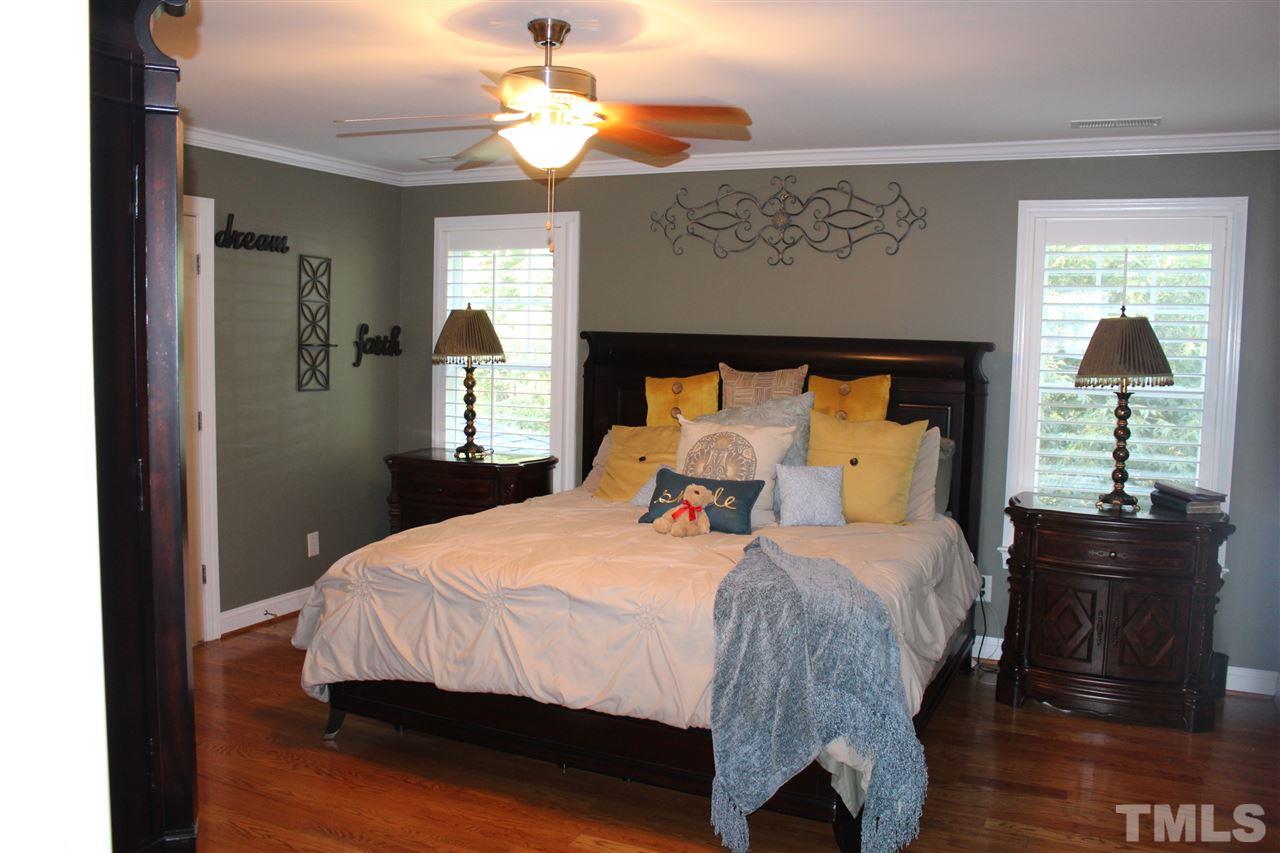 12336 Beestone Lane Raleigh, NC 27614 - Photo 17 of 21 a bedroom with a bed and a window