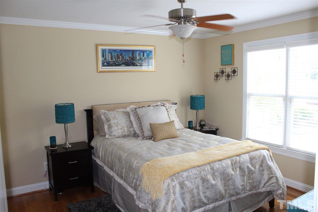 12336 Beestone Lane Raleigh, NC 27614 - Photo 18 of 21 a bedroom with a bed and a window