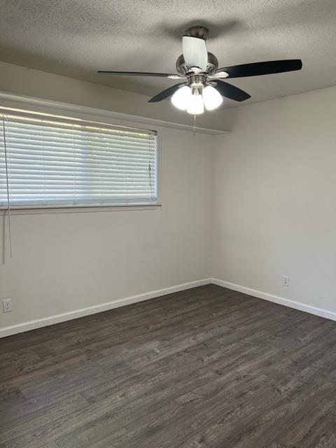 2898 Adler Avenue Clovis, CA 93612 - Photo 11 of 12 a view of an empty room with wooden floor and a window