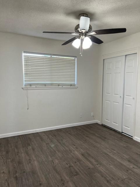 2898 Adler Avenue Clovis, CA 93612 - Photo 12 of 12 a view of an empty room with wooden floor and a ceiling fan