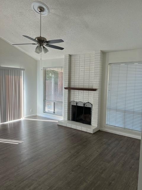 2898 Adler Avenue Clovis, CA 93612 - Photo 3 of 12 a view of an empty room with wooden floor fireplace and a window