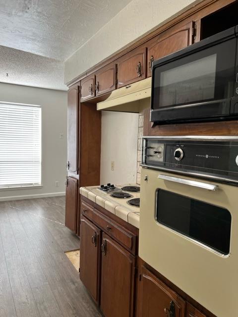 2898 Adler Avenue Clovis, CA 93612 - Photo 5 of 12 a kitchen with a stove and a microwave
