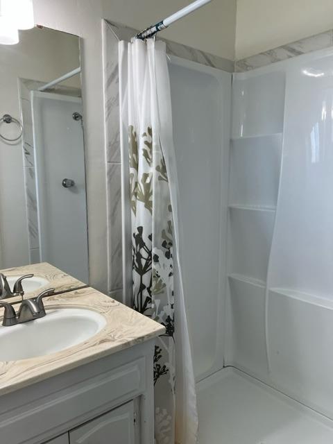 2898 Adler Avenue Clovis, CA 93612 - Photo 9 of 12 a bathroom with a sink and a mirror