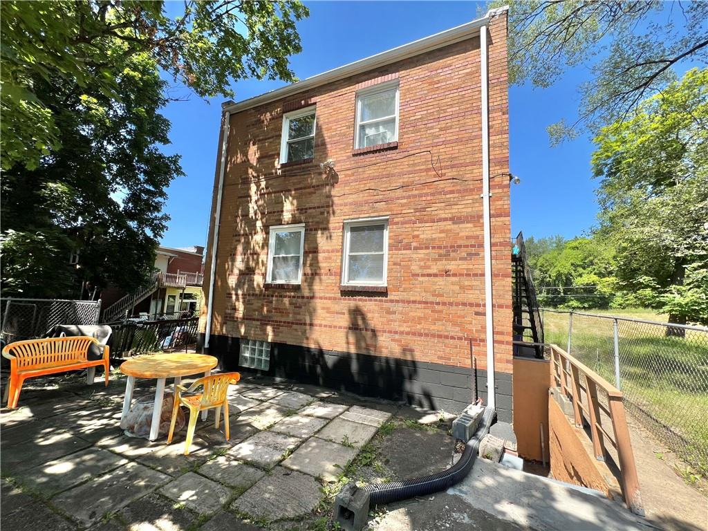 806 Inwood Street Pittsburgh, PA 15208 - Photo 3 of 17 a view of a patio with chair and tables back yard of the house