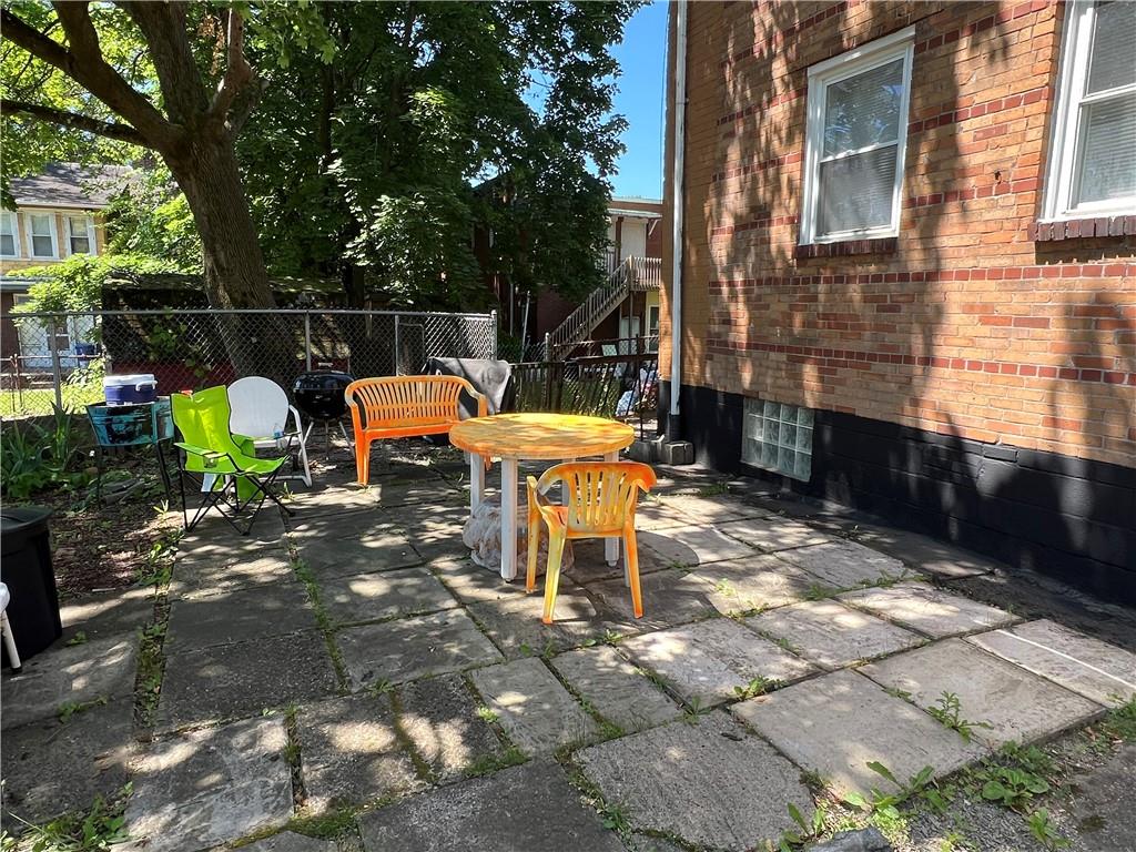 806 Inwood Street Pittsburgh, PA 15208 - Photo 4 of 17 a chairs and table in a backyard