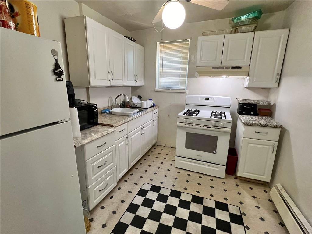 806 Inwood Street Pittsburgh, PA 15208 - Photo 7 of 17 a kitchen with appliances cabinets and a stove top oven