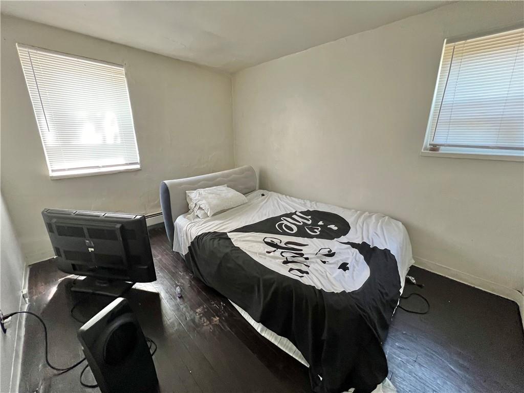 806 Inwood Street Pittsburgh, PA 15208 - Photo 9 of 17 a bedroom with a bed and a table