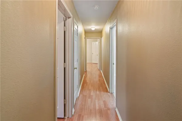 a view of gallery with wooden floor
