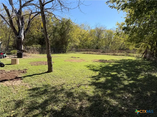 a bathroom with a sink toilet and a mirror
