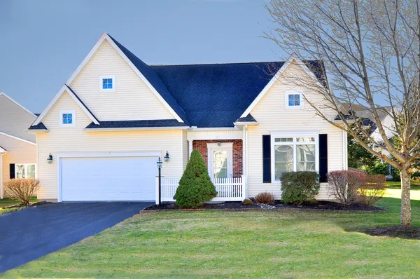 a front view of a house with garden