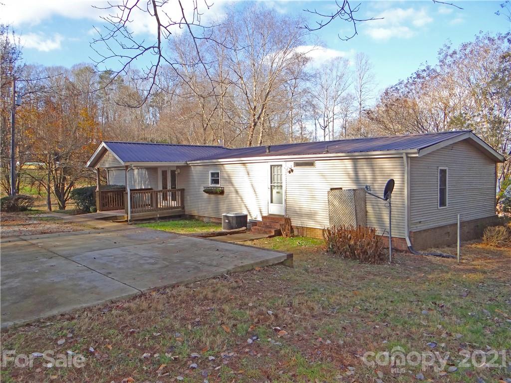 4053 Chevlot Hills Road Sherrills Ford, NC 28673 - Photo 2 of 22 a view of a house with backyard and a tree