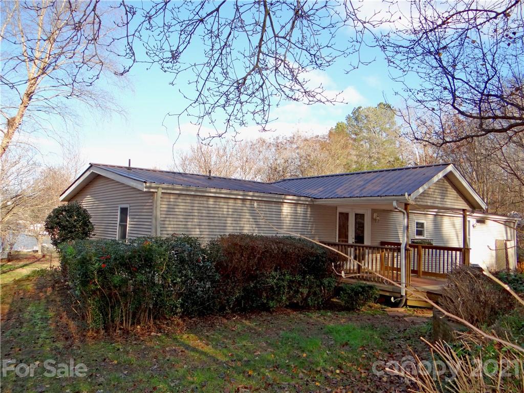 4053 Chevlot Hills Road Sherrills Ford, NC 28673 - Photo 12 of 22 a view of a house with backyard and garden