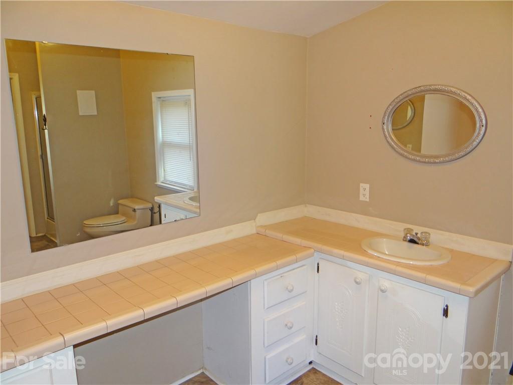 4053 Chevlot Hills Road Sherrills Ford, NC 28673 - Photo 16 of 22 a bathroom with a sink and a mirror