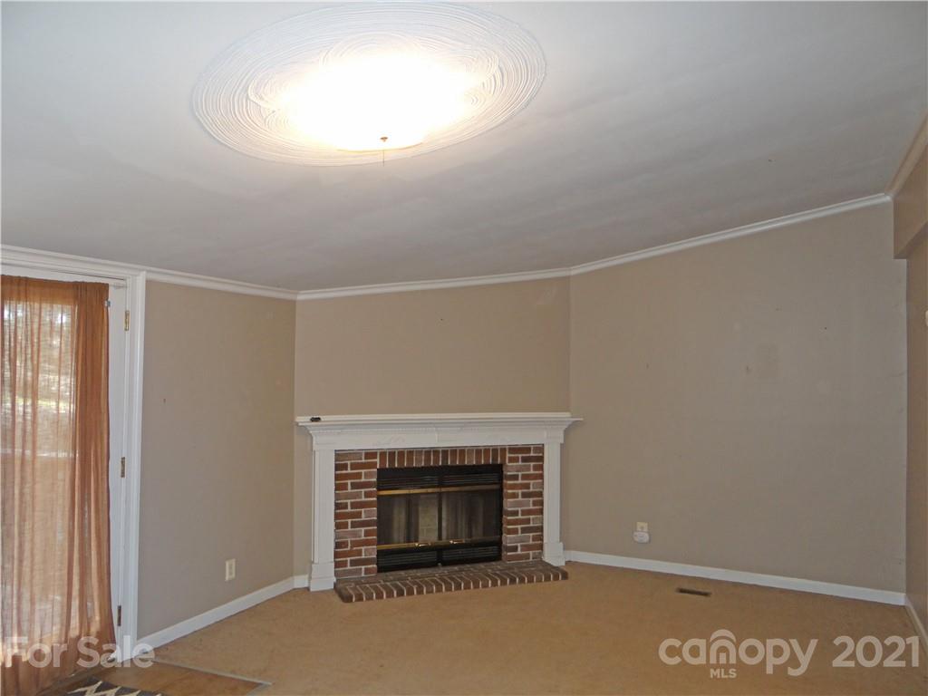 4053 Chevlot Hills Road Sherrills Ford, NC 28673 - Photo 17 of 22 an empty room with a fireplace