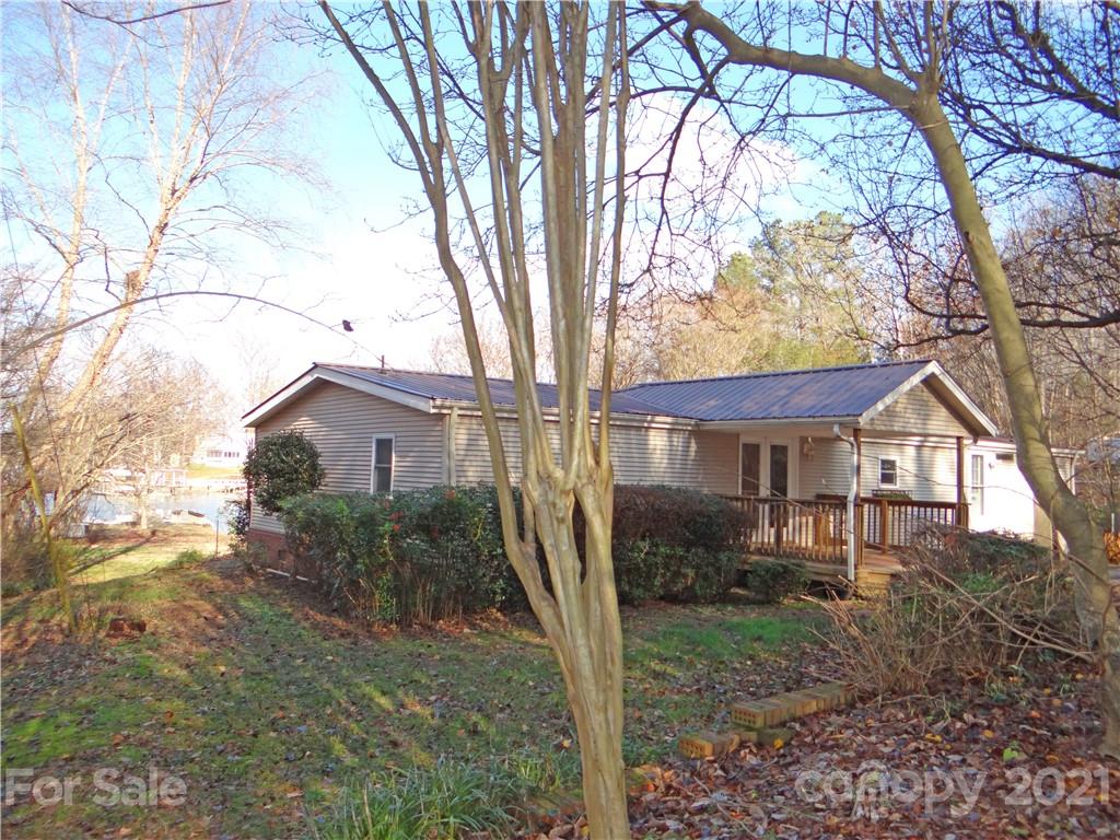 4053 Chevlot Hills Road Sherrills Ford, NC 28673 - Photo 3 of 22 a view of a house with a tree in the yard