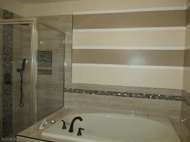 a bathroom with a bath tub