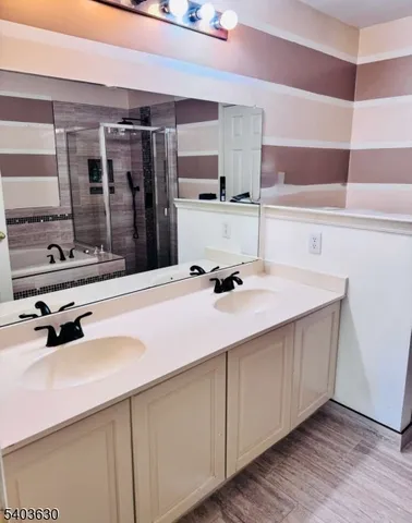 a kitchen with stainless steel appliances a sink and cabinets