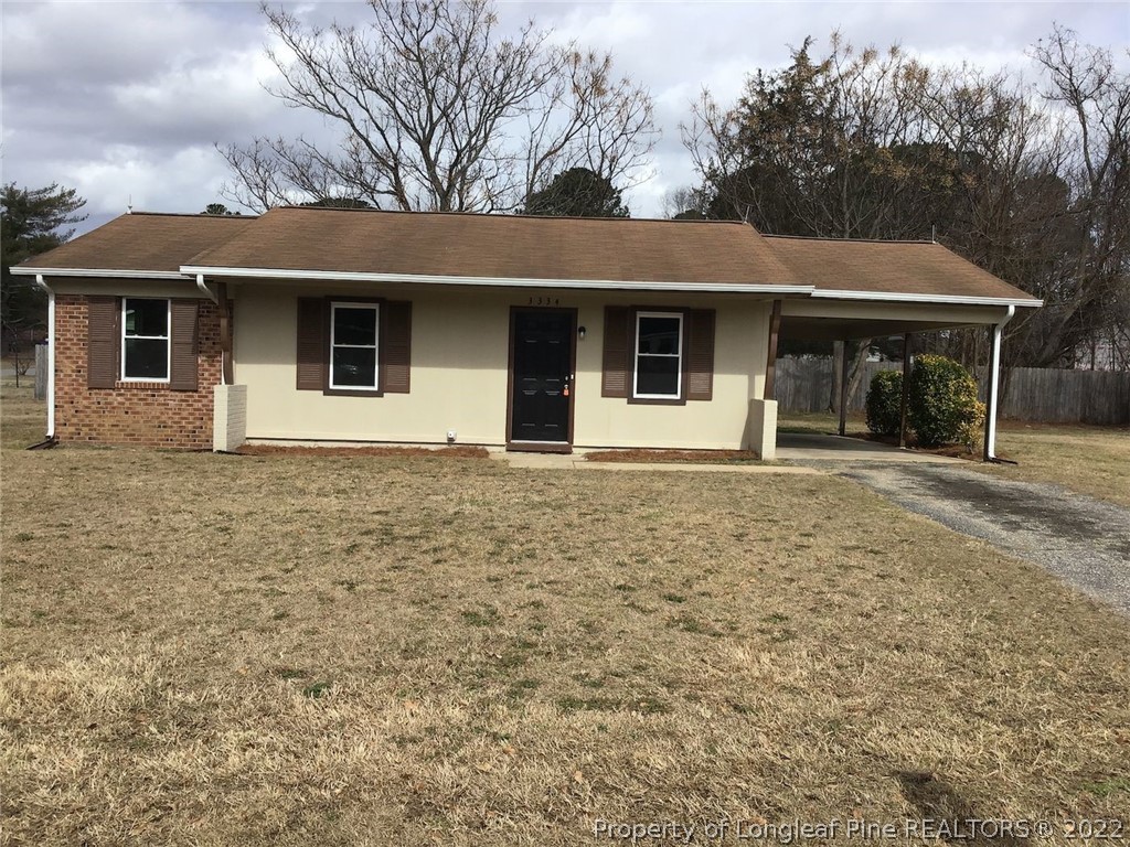 3334 Raintree Drive Fayetteville, NC 28304 - Photo 1 of 11 a front view of a house with yard