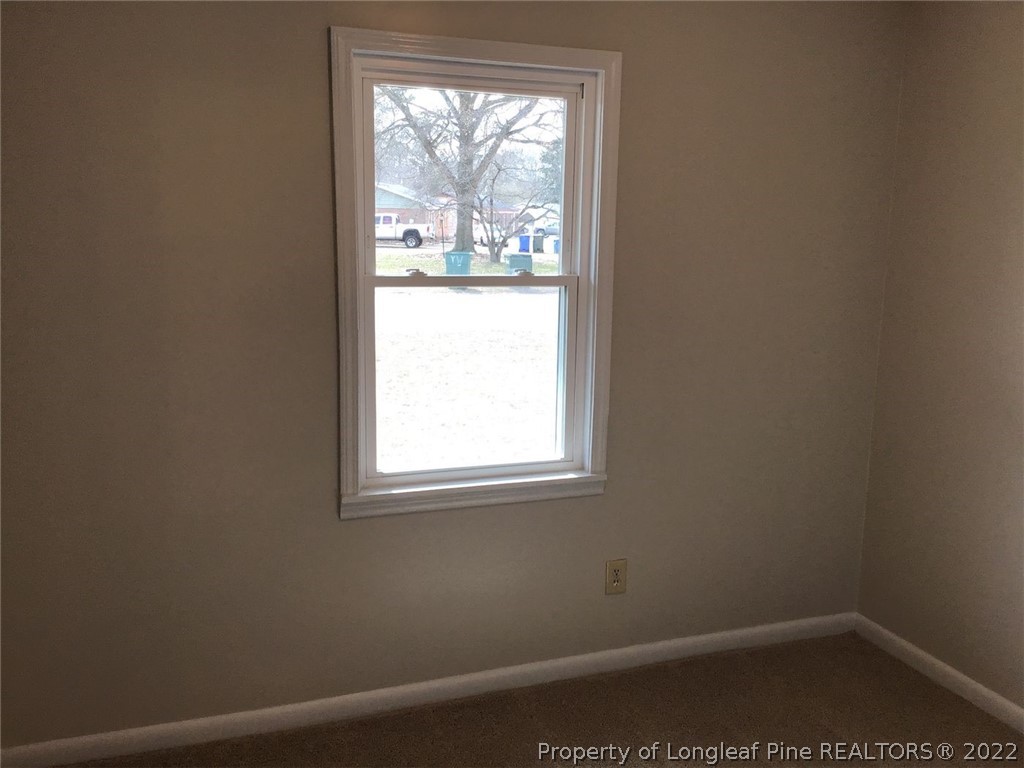 3334 Raintree Drive Fayetteville, NC 28304 - Photo 6 of 11 an empty room with a window