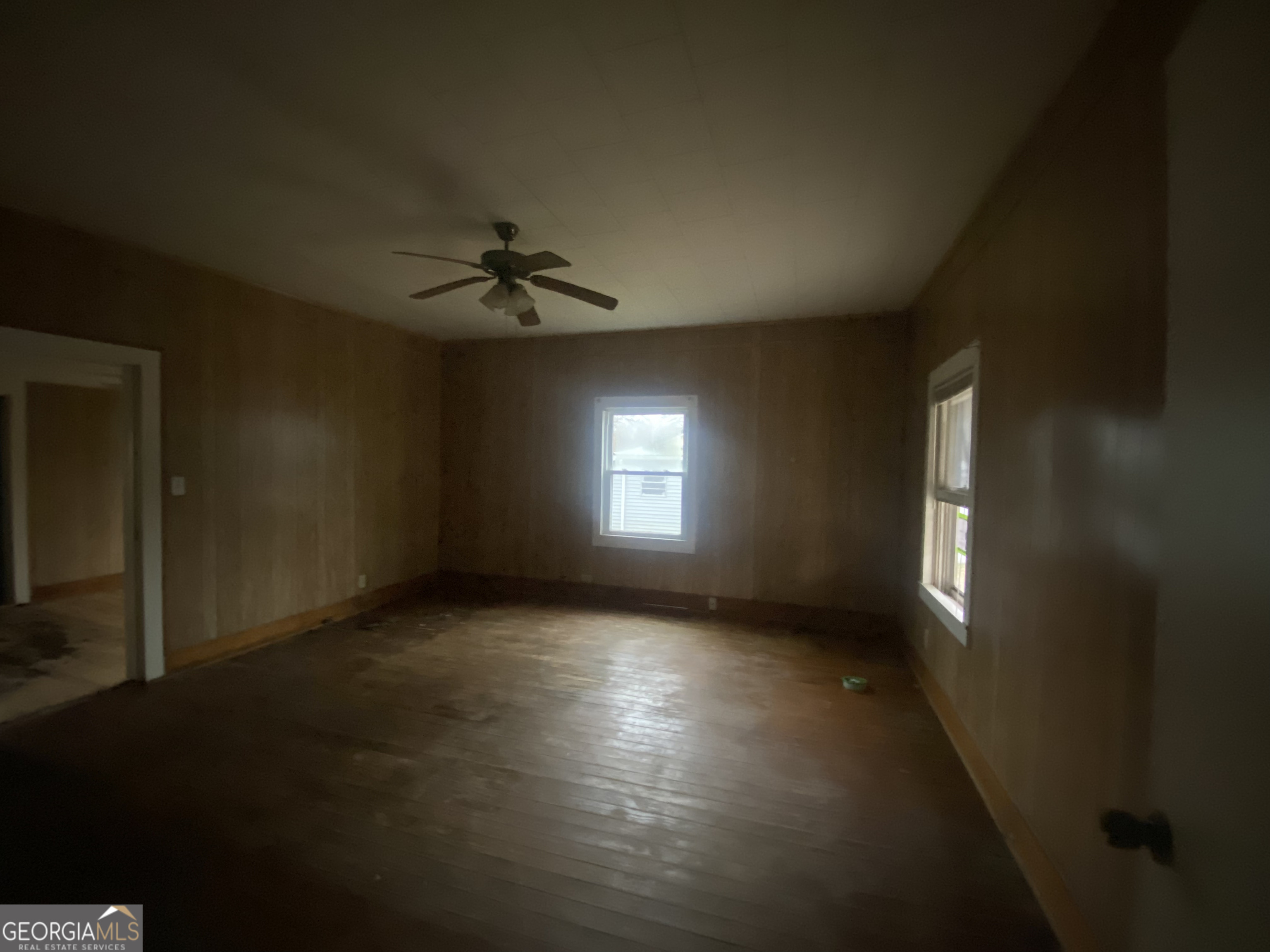 195 7th Street Trion, GA 30753 - Photo 8 of 10 an empty room with windows and ceiling fan