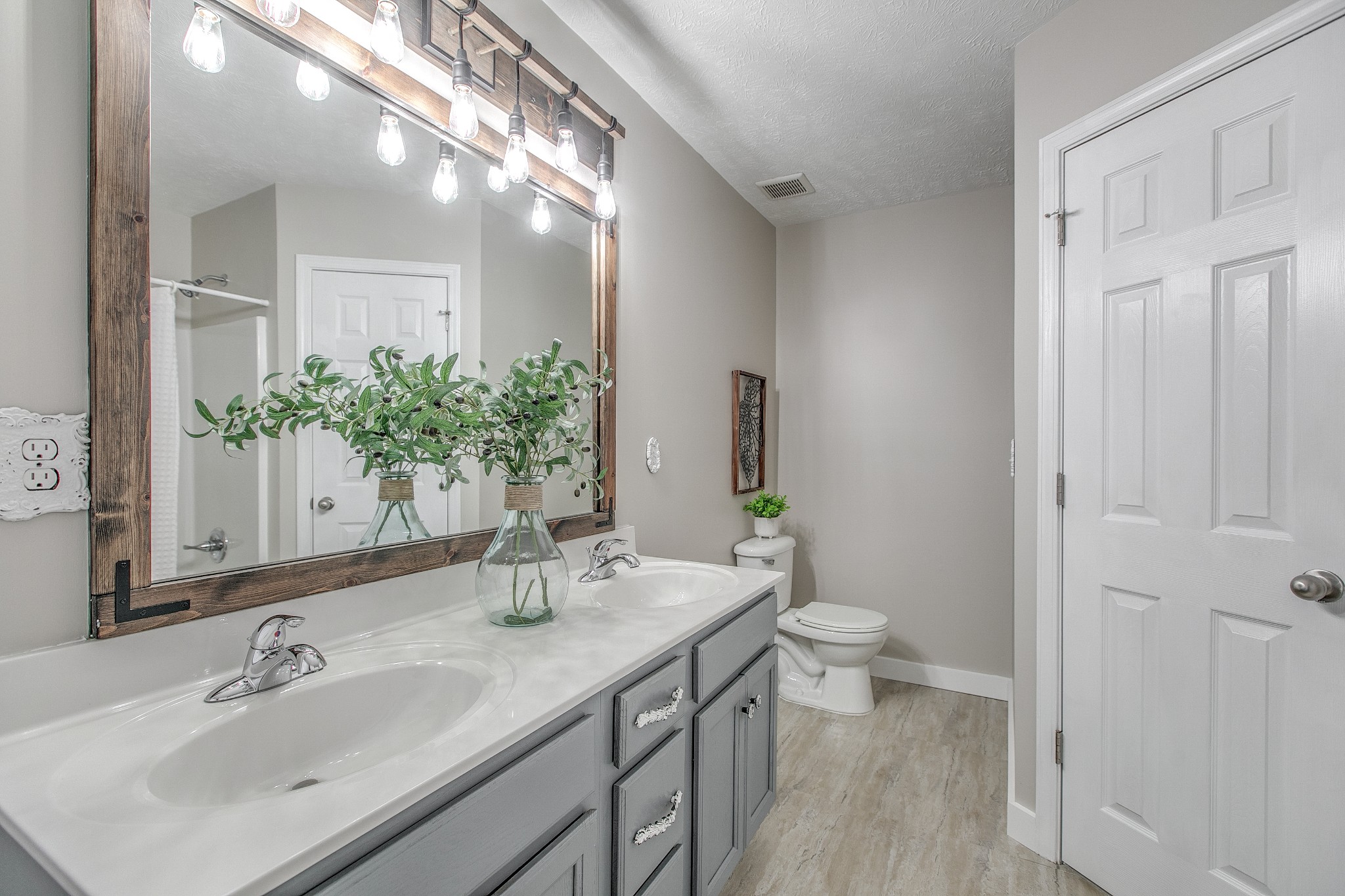 1025 Maxfli Drive Murfreesboro, TN 37129 - Photo 20 of 42 a bathroom with a granite countertop sink a toilet and a mirror