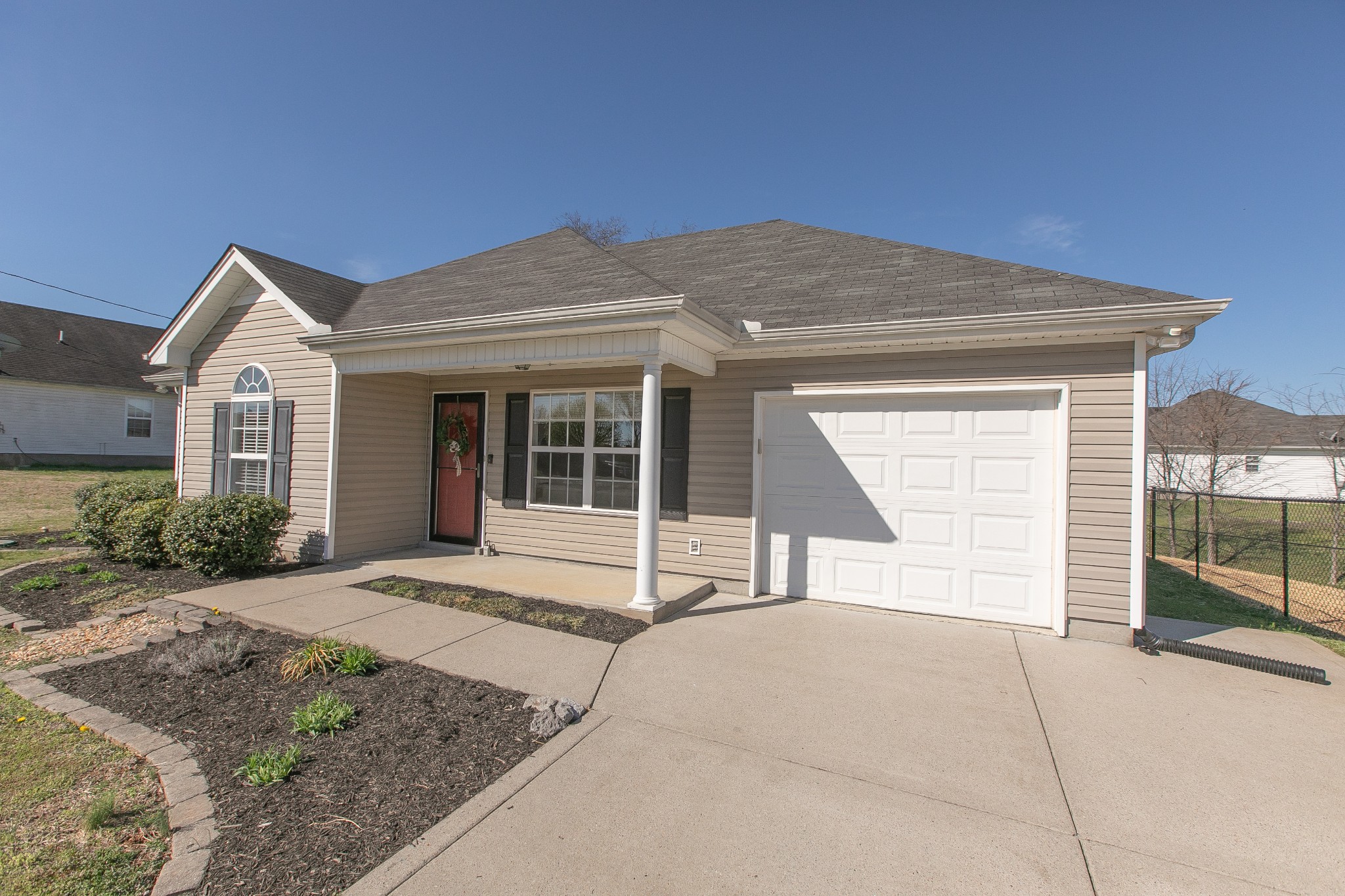 1025 Maxfli Drive Murfreesboro, TN 37129 - Photo 2 of 42 a house view with a backyard space