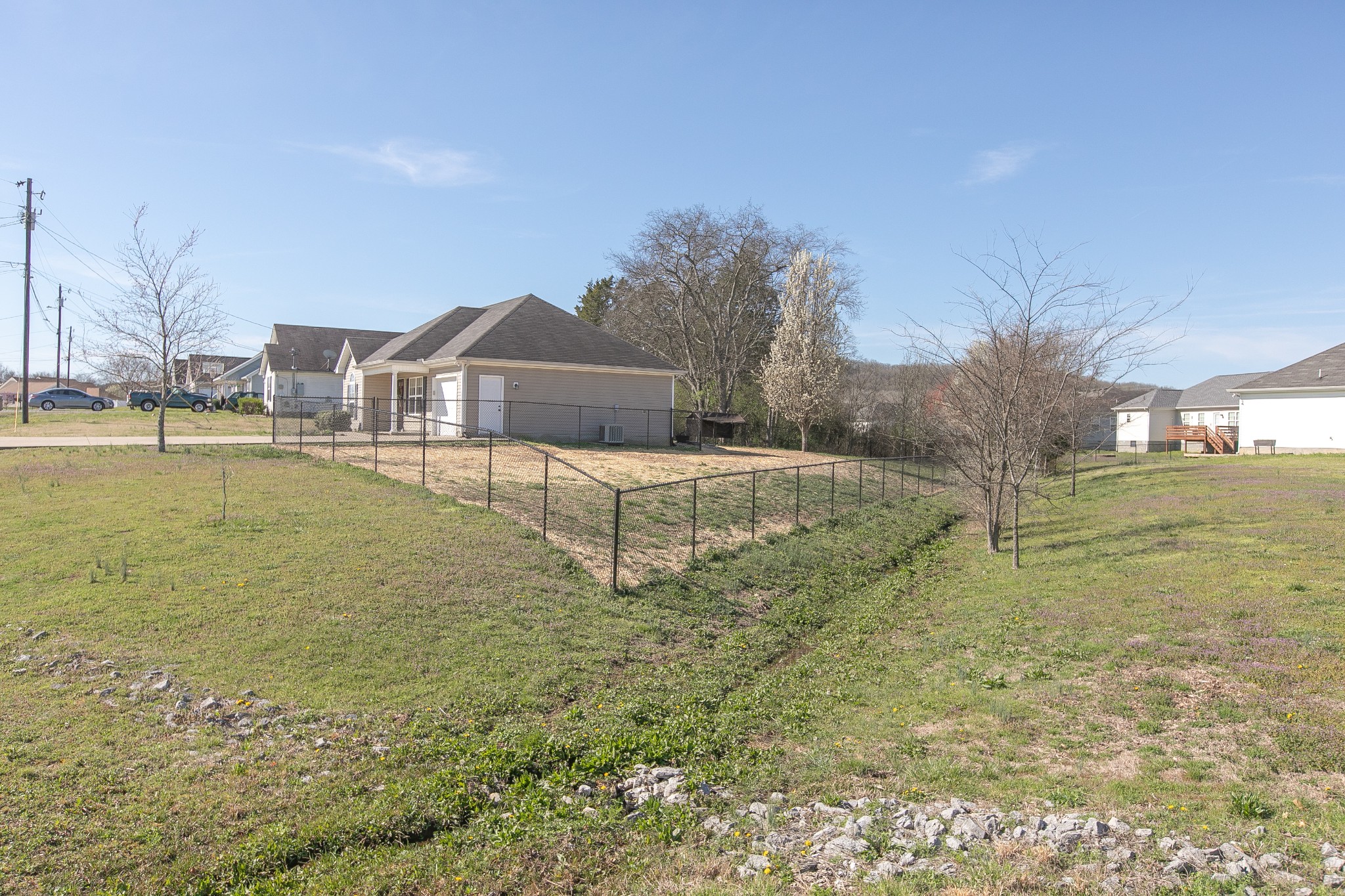 1025 Maxfli Drive Murfreesboro, TN 37129 - Photo 35 of 42 a large pool that has lawn chairs and a dining table under an umbrella