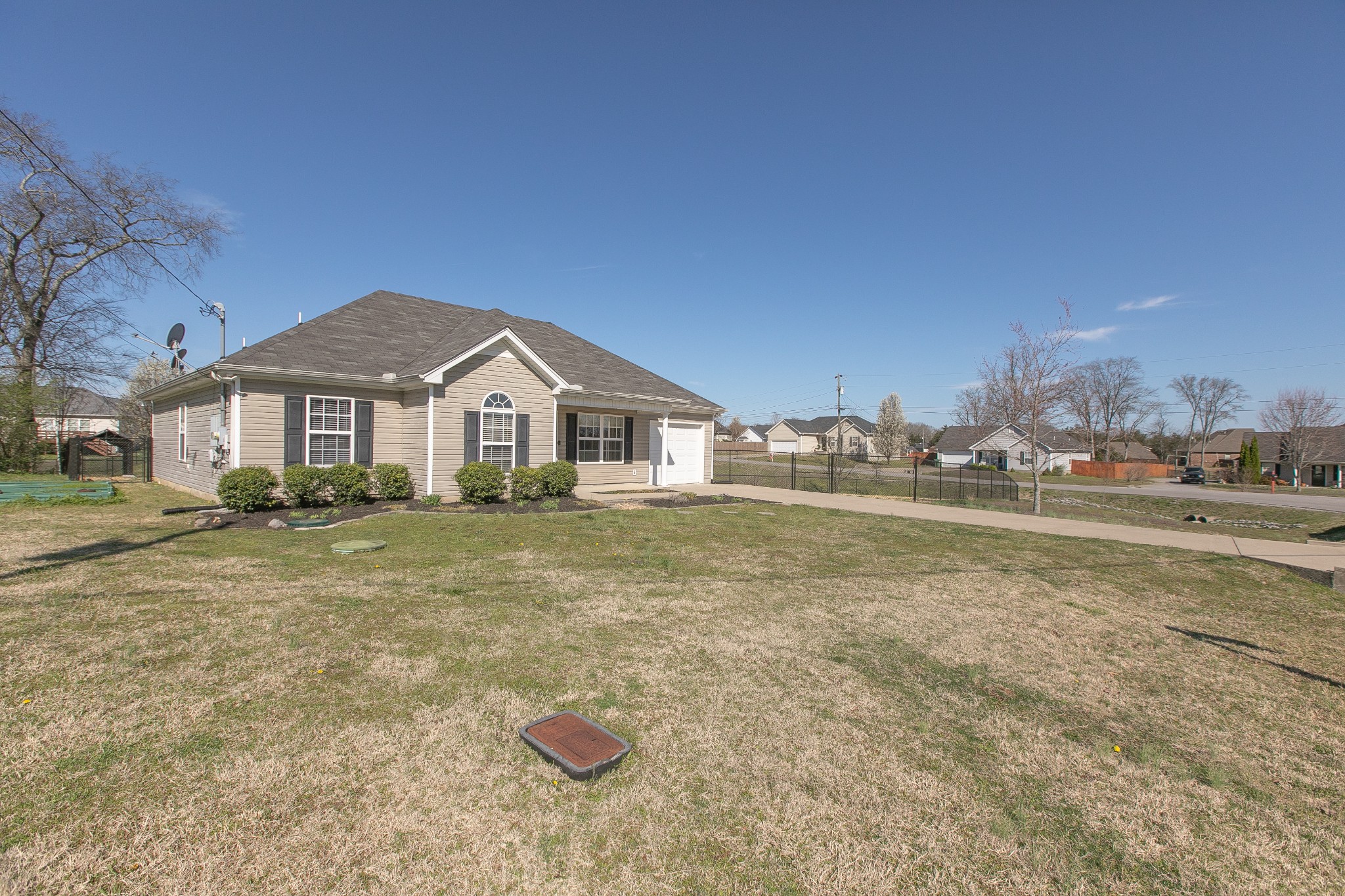1025 Maxfli Drive Murfreesboro, TN 37129 - Photo 40 of 42 a front view of a house with a yard
