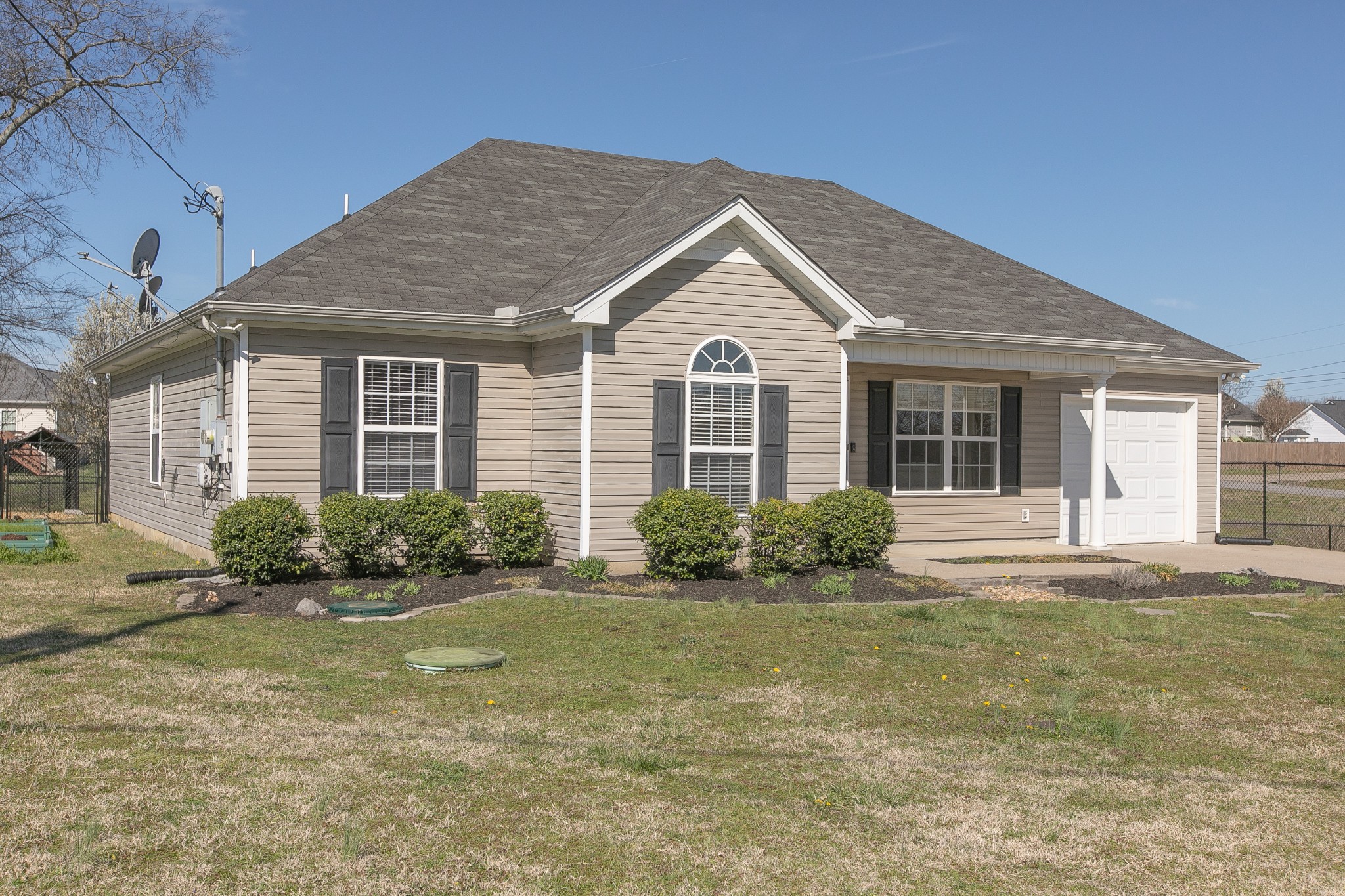 1025 Maxfli Drive Murfreesboro, TN 37129 - Photo 41 of 42 a front view of a house with a yard