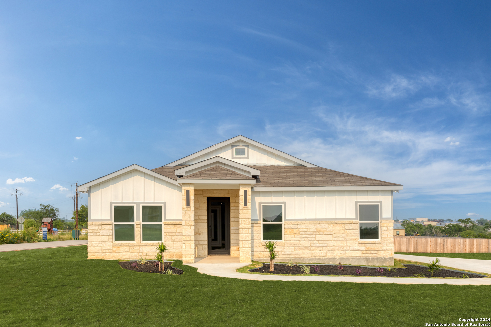 a front view of a house with a yard