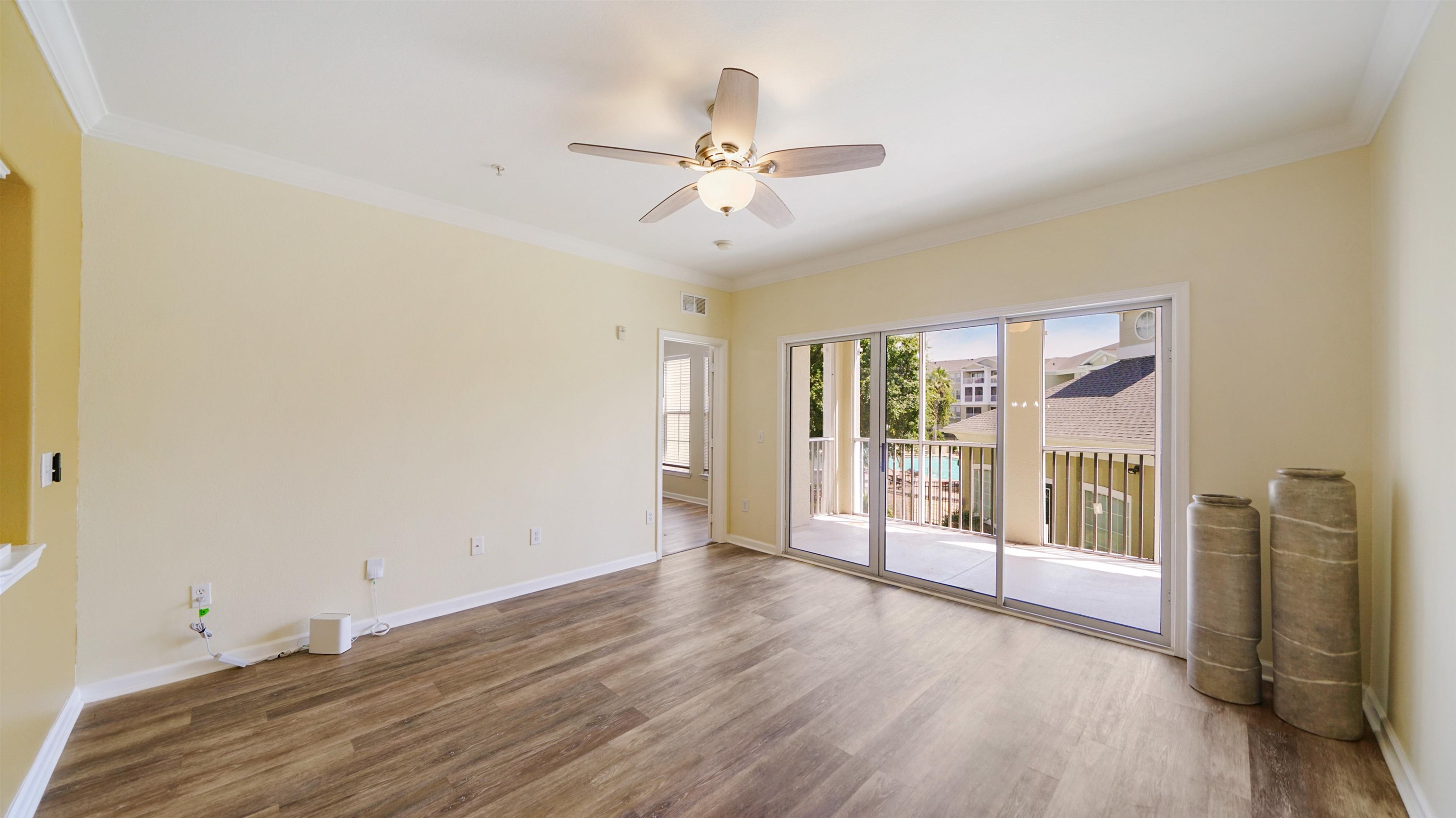 8290 Gate Parkway, Unit 709 Jacksonville, FL 32216 - Photo 11 of 30 wooden floor in an empty room with a window