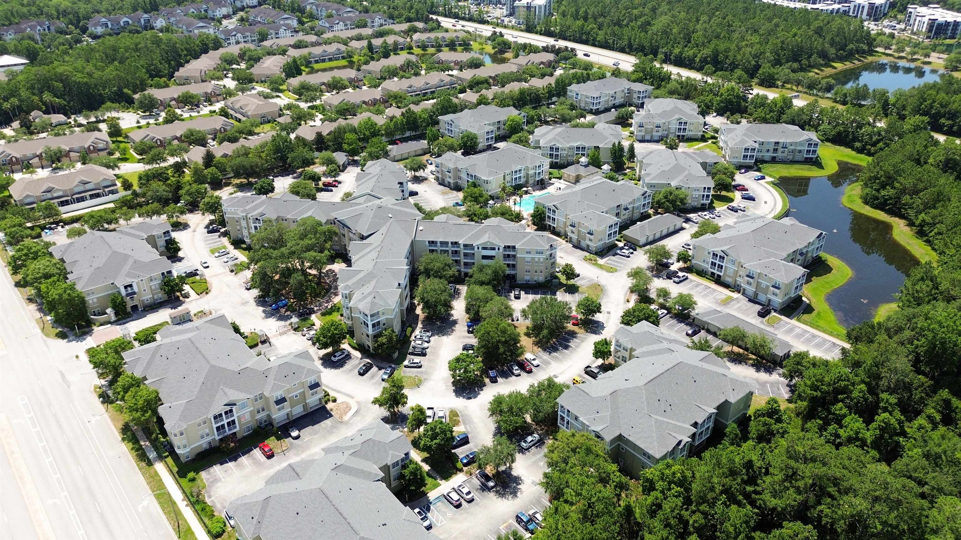 8290 Gate Parkway, Unit 709 Jacksonville, FL 32216 - Photo 23 of 30 an aerial view of residential houses with outdoor space