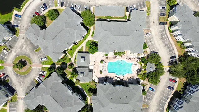 an aerial view of a house a yard and a fireplace