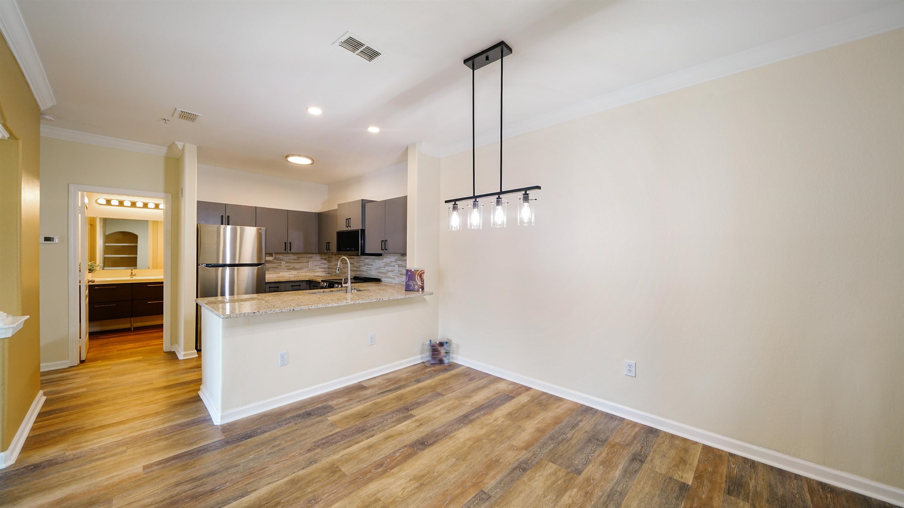 8290 Gate Parkway, Unit 709 Jacksonville, FL 32216 - Photo 10 of 30 a view of a kitchen with wooden floor