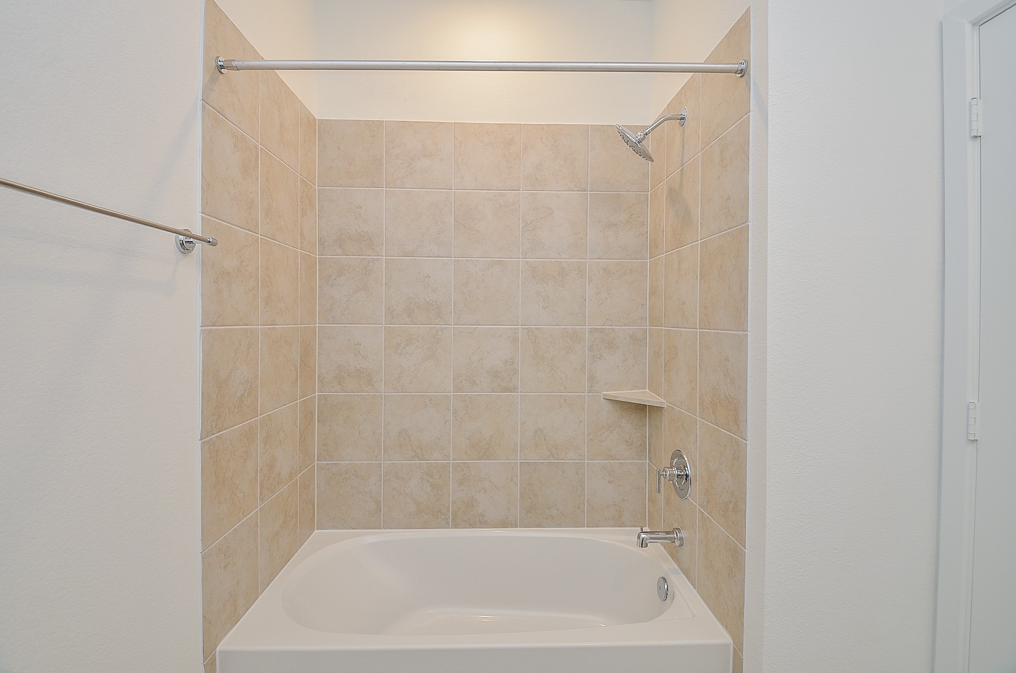 9727 Rialto Hts Drive Cypress, TX 77433 - Photo 30 of 37 This bathroom features a spacious double vanity with ample storage, a large mirror, and a walk-in shower with tiled walls. The neutral color palette and recessed lighting create a bright and inviting atmosphere.