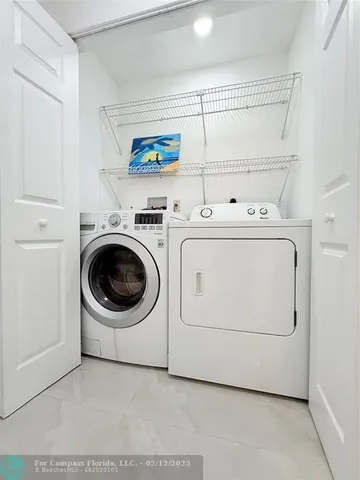 a kitchen with stainless steel appliances granite countertop a refrigerator sink and cabinets