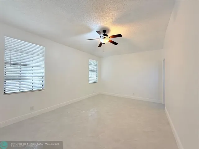 a bathroom with a sink and mirror with toilet