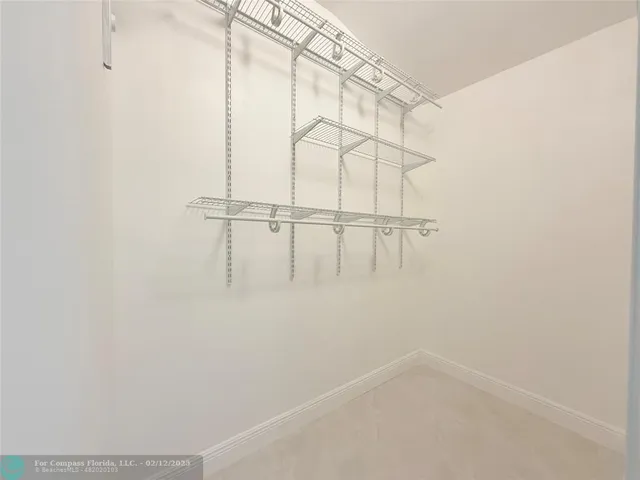 a large bathroom with a double vanity sink mirror and shower