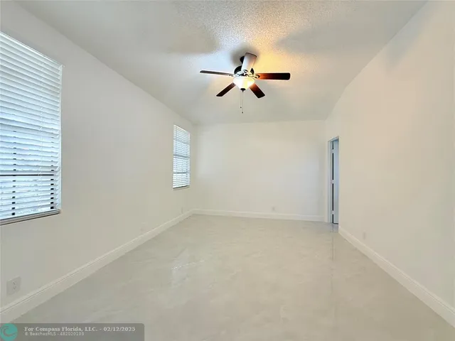 a bathroom with a double vanity sink a large mirror and a shower