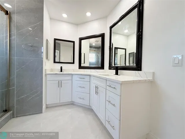 a bathroom with a toilet a sink and a mirror