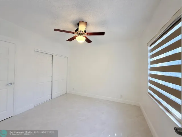 a view of balcony with a potted plant