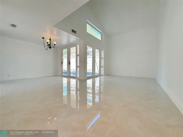 a view of an empty room and window