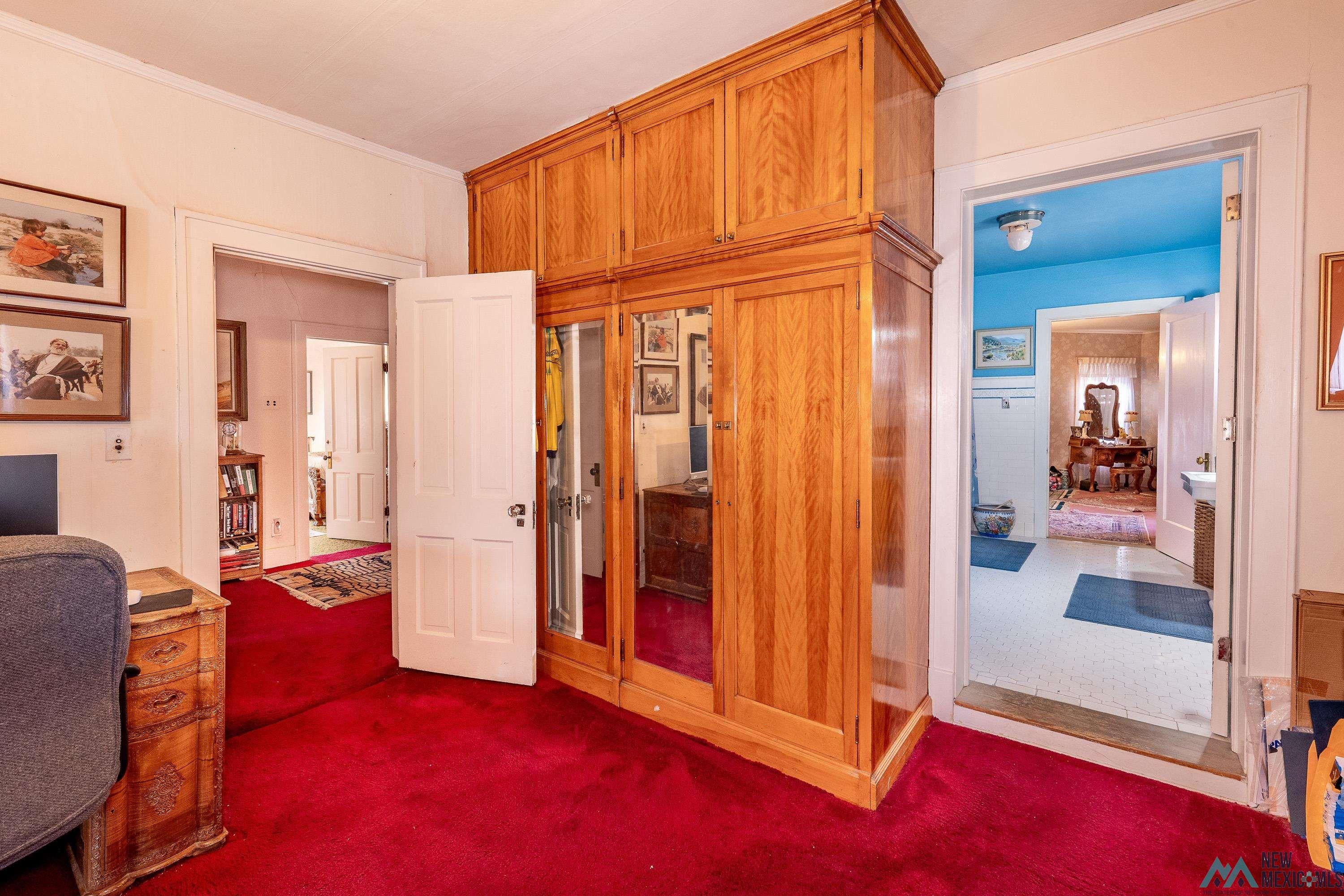 301 South 4th Street Raton, NM 87740 - Photo 26 of 78 Office area with dark carpet and crown molding