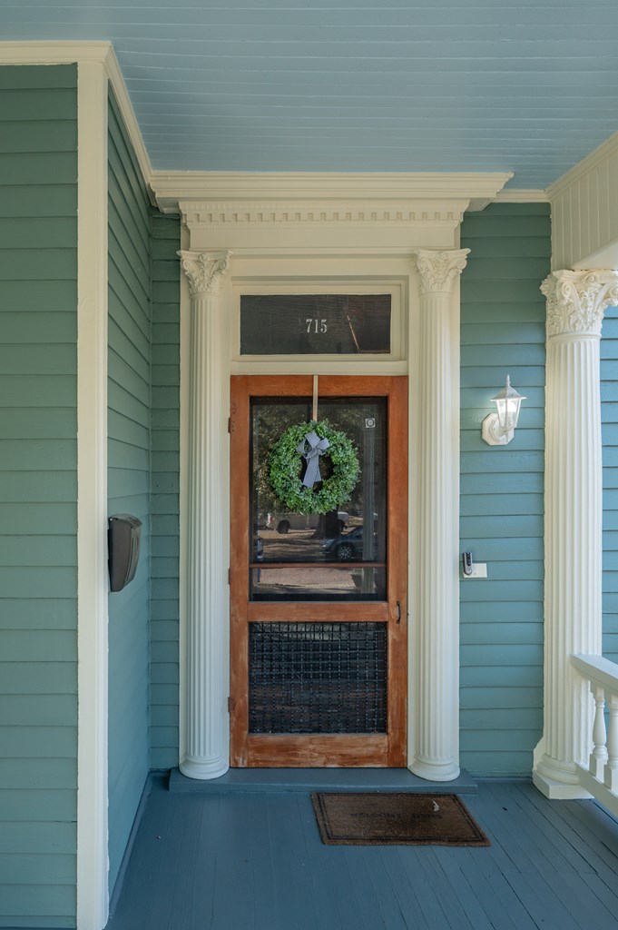 715 Broadway Columbus, GA 31901 - Photo 11 of 75 a view of a livingroom with wooden floor and a fireplace