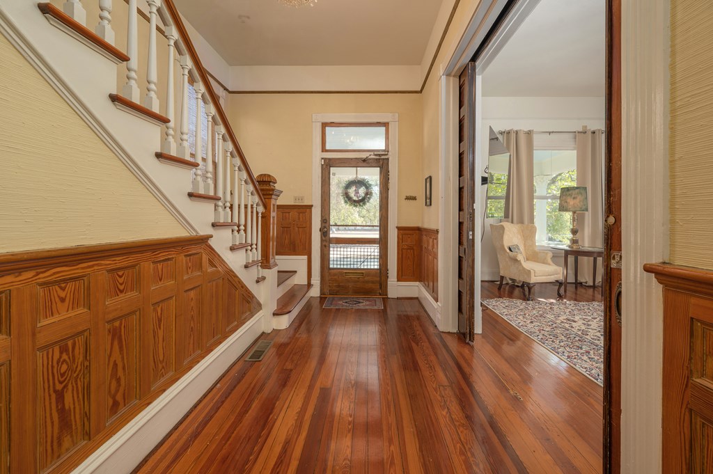 715 Broadway Columbus, GA 31901 - Photo 14 of 75 a view of a hallway view with wooden floor and staircase
