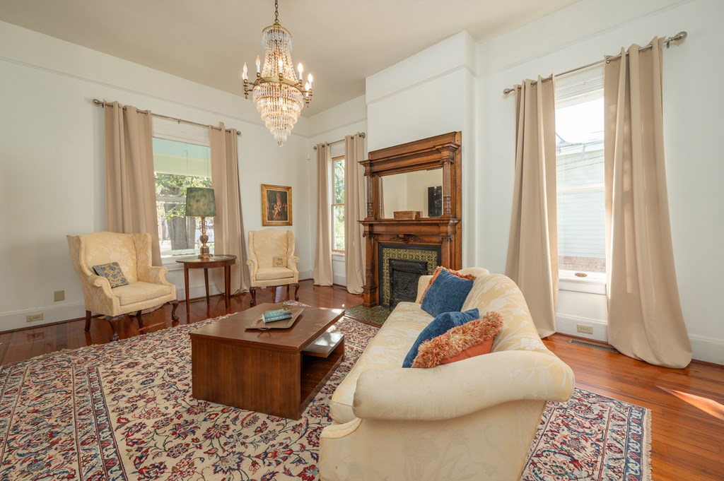 715 Broadway Columbus, GA 31901 - Photo 20 of 75 a living room with fireplace furniture and a chandelier