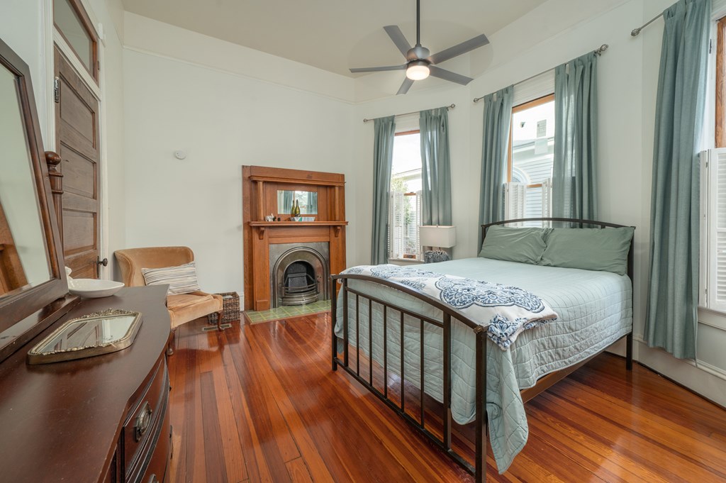 715 Broadway Columbus, GA 31901 - Photo 30 of 75 a bedroom with a bed and wooden floor