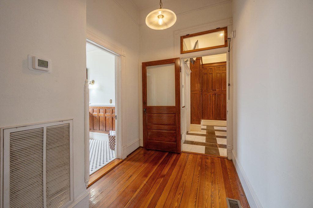 715 Broadway Columbus, GA 31901 - Photo 31 of 75 a view of a hallway with wooden floor and closet